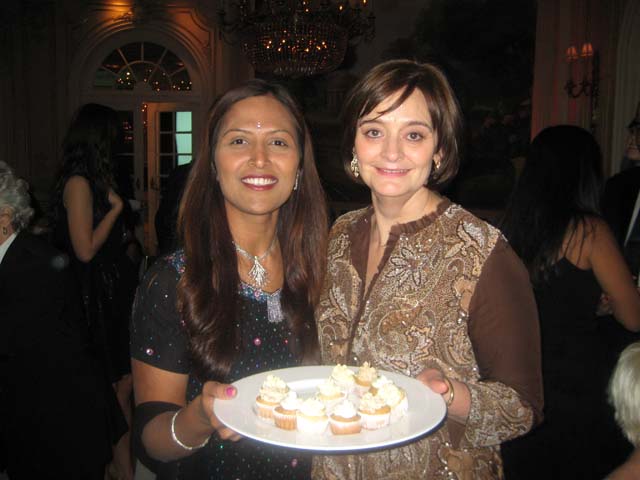 Parul Patel Parul Patel of The Cake Designer offers a tasting to former First Lady of the UK, Cherie Blair, at a fundraiser. Patel specializes in eggless vegetarian cakes.